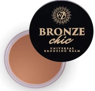 W7 Bronze Chic Universal Bronzing Balm jar, featuring a sleek black lid and a golden-brown balm inside.